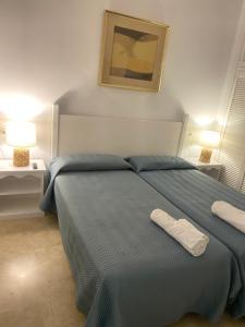 Posteľ alebo postele v izbe v ubytovaní Apartament Alameda center