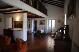 a living room with a table and chairs at Sunrise in Rapallo