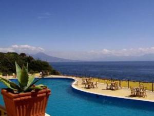 a swimming pool with a view of the ocean at Residence Posillipo in Naples