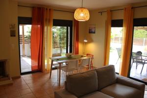 a living room with a couch and a table at T&A Apartment,near the sea. in Marathón