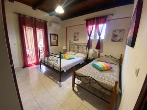Posteľ alebo postele v izbe v ubytovaní Themis apartment