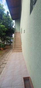 a stairway leading up to a building with a staircase at Hotel Joman Goiânia in Goiânia