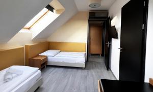 Voodi või voodid majutusasutuse Hotel Žabčice toas