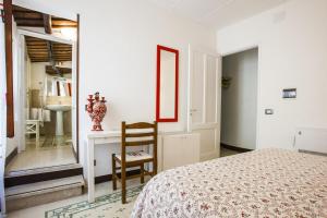 A bed or beds in a room at Antico Borgo