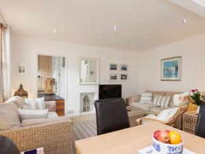 a living room with a couch and a table at Snugglers Cove Apt 2 in Dartmouth