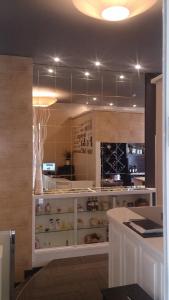 a kitchen with a counter with a wine cellar at Hotel a Muradana in Muros