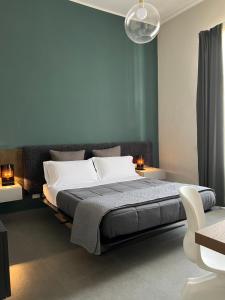A bed or beds in a room at Catania Rooms