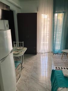 A kitchen or kitchenette at valantis room Még 7 kép