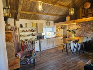 a kitchen with a table and a dining room at Tiernan's Luxury Accommodation in Charlestown