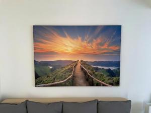 road to the horizon stretched canvas wall art living room at Jacky & Daniel's Apartments Top 1 in Sankt Pölten
