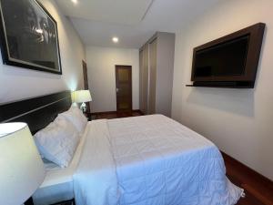 Ein Bett oder Betten in einem Zimmer der Unterkunft Departamento Premium, categoría 5 estrellas