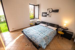 Кровать или кровати в номере La casa dei pini