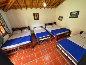 Postel nebo postele na pokoji v ubytování Finca Hotel Cabaña Fercho