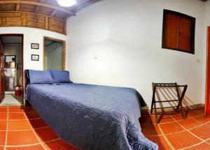 Postel nebo postele na pokoji v ubytování Finca Hotel Cabaña Fercho