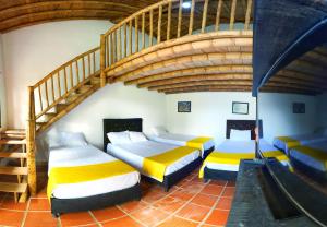 Postel nebo postele na pokoji v ubytování Finca Hotel Cabaña Fercho