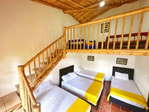 Postel nebo postele na pokoji v ubytování Finca Hotel Cabaña Fercho
