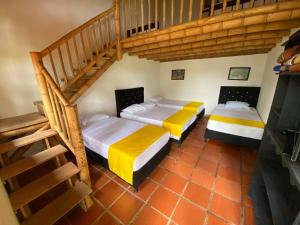 Postel nebo postele na pokoji v ubytování Finca Hotel Cabaña Fercho