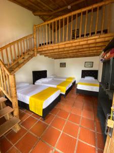 Postel nebo postele na pokoji v ubytování Finca Hotel Cabaña Fercho