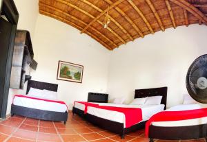 Postel nebo postele na pokoji v ubytování Finca Hotel Cabaña Fercho