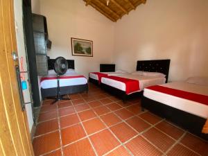 Postel nebo postele na pokoji v ubytování Finca Hotel Cabaña Fercho