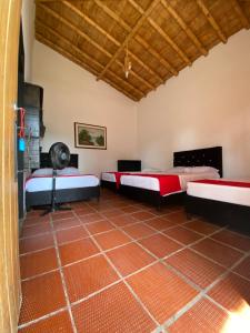Postel nebo postele na pokoji v ubytování Finca Hotel Cabaña Fercho