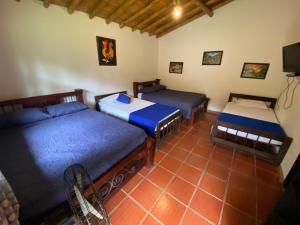 Postel nebo postele na pokoji v ubytování Finca Hotel Cabaña Fercho