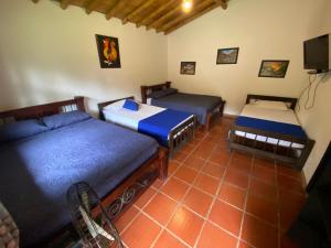 Postel nebo postele na pokoji v ubytování Finca Hotel Cabaña Fercho