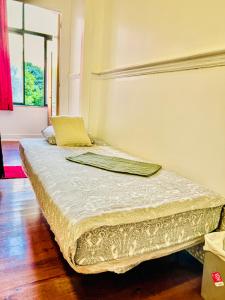a bed sitting in a room with at Fortune Guest house in Lisbon
