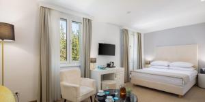 Postel nebo postele na pokoji v ubytování Aminess Younique Bellevue Hotel
