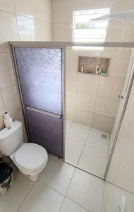 a bathroom with a shower and a toilet in it at Casa de Luís Correia in Luis Correia