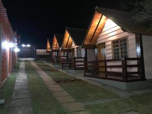 a row of houses lit up at night at Chalé da Serra in São João del Rei