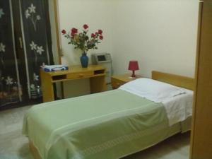 Postel nebo postele na pokoji v ubytování Hotel Apollo