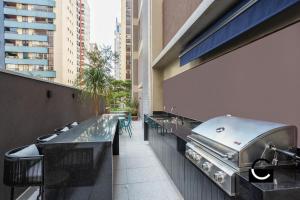 a bar with a grill on the side of a building at Studio 31 m2 Parque Ibirapuera Itaim Bibi in Sao Paulo