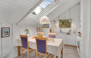 a kitchen with a table and chairs and a window at 4 Bedroom Stunning Home In Kalundborg in Kalundborg