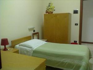 Postel nebo postele na pokoji v ubytování Hotel Apollo