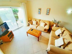 a living room with two couches and a coffee table at Algarver II-Boavista Golf Fairview Swimpool Apartment in Lagos