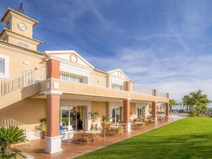 a large building with a clock tower on top of it at Algarver II-Boavista Golf Fairview Swimpool Apartment in Lagos
