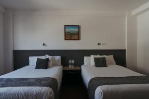 Postel nebo postele na pokoji v ubytování Hoteles Unico Express