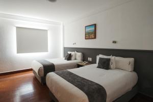 Postel nebo postele na pokoji v ubytování Hoteles Unico Express