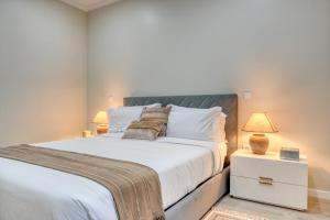 Postel nebo postele na pokoji v ubytování Tristão Vaz II, a Home in Madeira