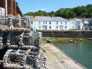 a pile of nets on the side of a body of water at Quarry Cottage in Flushing