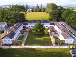 an aerial view of a house with solar panels at Fir Cottage - Uk38485 in Saltash