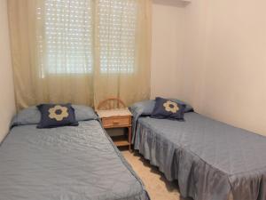 Posteľ alebo postele v izbe v ubytovaní PARQUE MOTA - AlquIler solo a familias