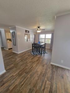 a living room with a table and a dining room at Convenient and Comfortable in Macon