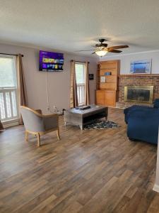 a living room with a couch and a fireplace at Convenient and Comfortable in Macon