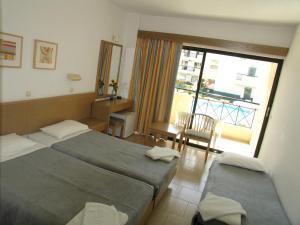 Ένα ή περισσότερα κρεβάτια σε δωμάτιο στο Summerland Hotel +30 φωτογραφίες