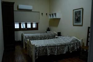 Tempat tidur dalam kamar di Lo de Poujade