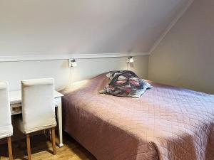 מיטה או מיטות בחדר ב-Holiday home ADELSÖ IV