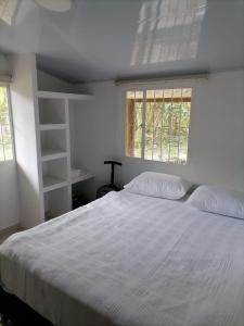 Postel nebo postele na pokoji v ubytování CASA CAMPESTRE LAS MARIAS