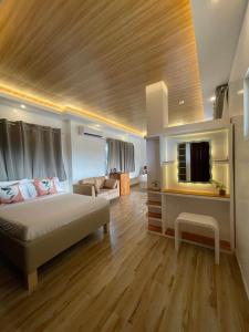 Postel nebo postele na pokoji v ubytování Bella Napoli Resort & Resto + 32 fotografií
